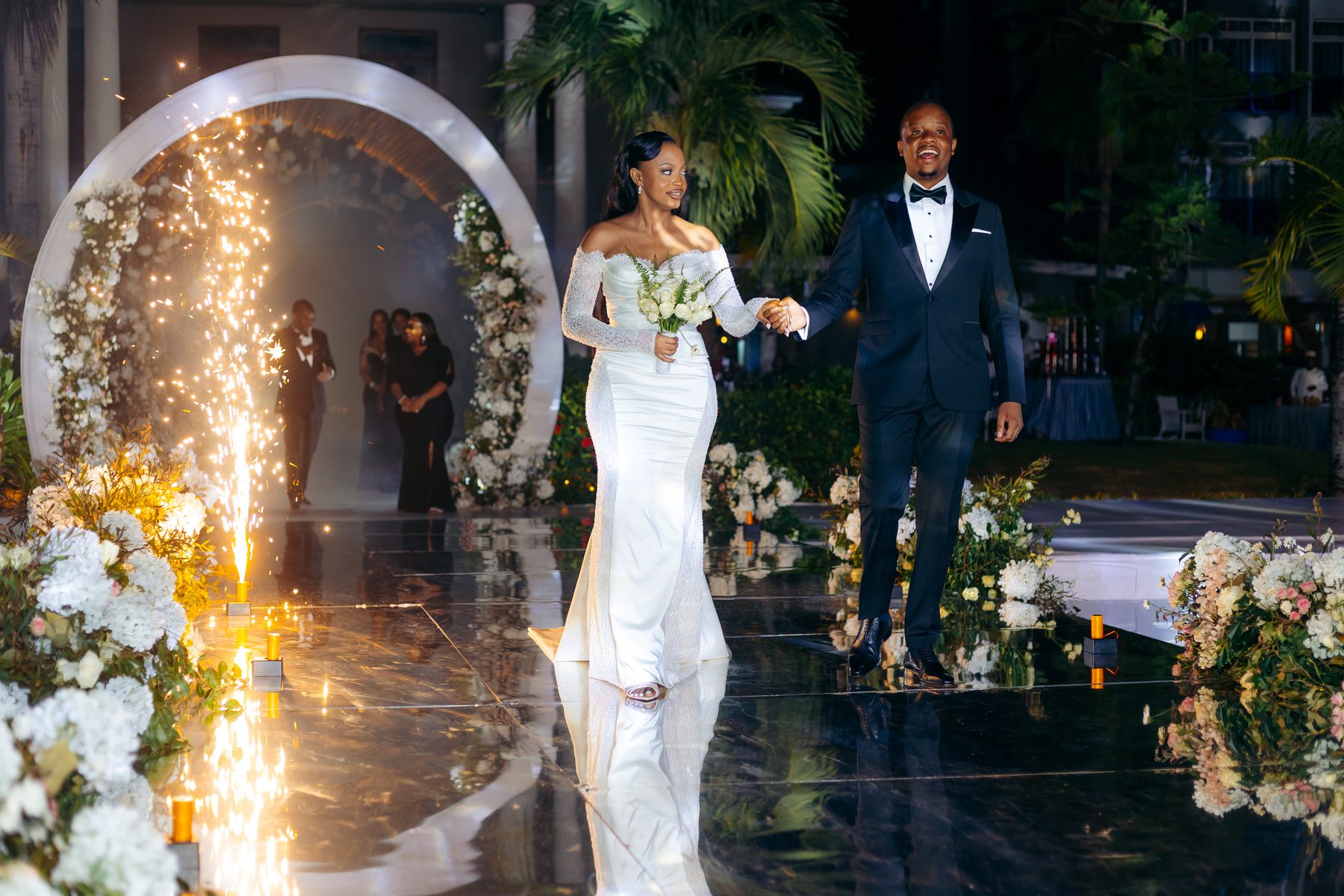 Ali & Dr. Lucy wedding in Tanga, Tanzania, by Kevins Events — grand entrance amid sparkler fountains