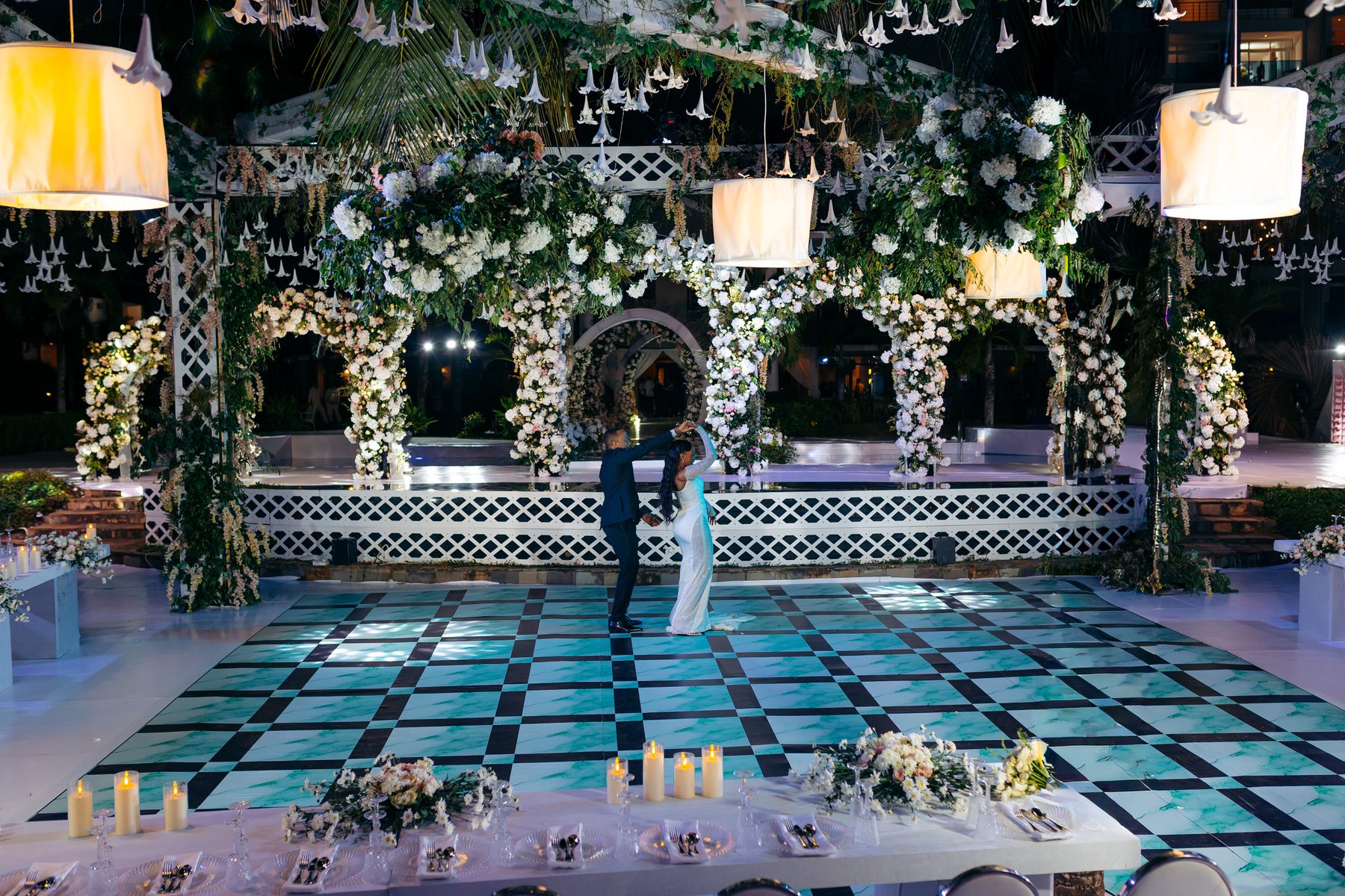 Ali & Dr. Lucy wedding in Tanga, Tanzania, by Kevins Events — first dance beneath the floral pavilion