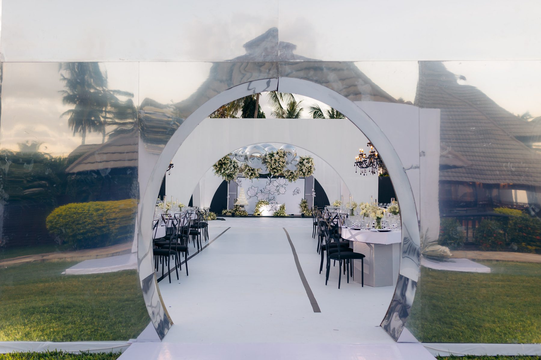 Anthony & Irene wedding at White Sands Resort, Dar es Salaam, by Kevins Events — the mirrored circular portal to the reception