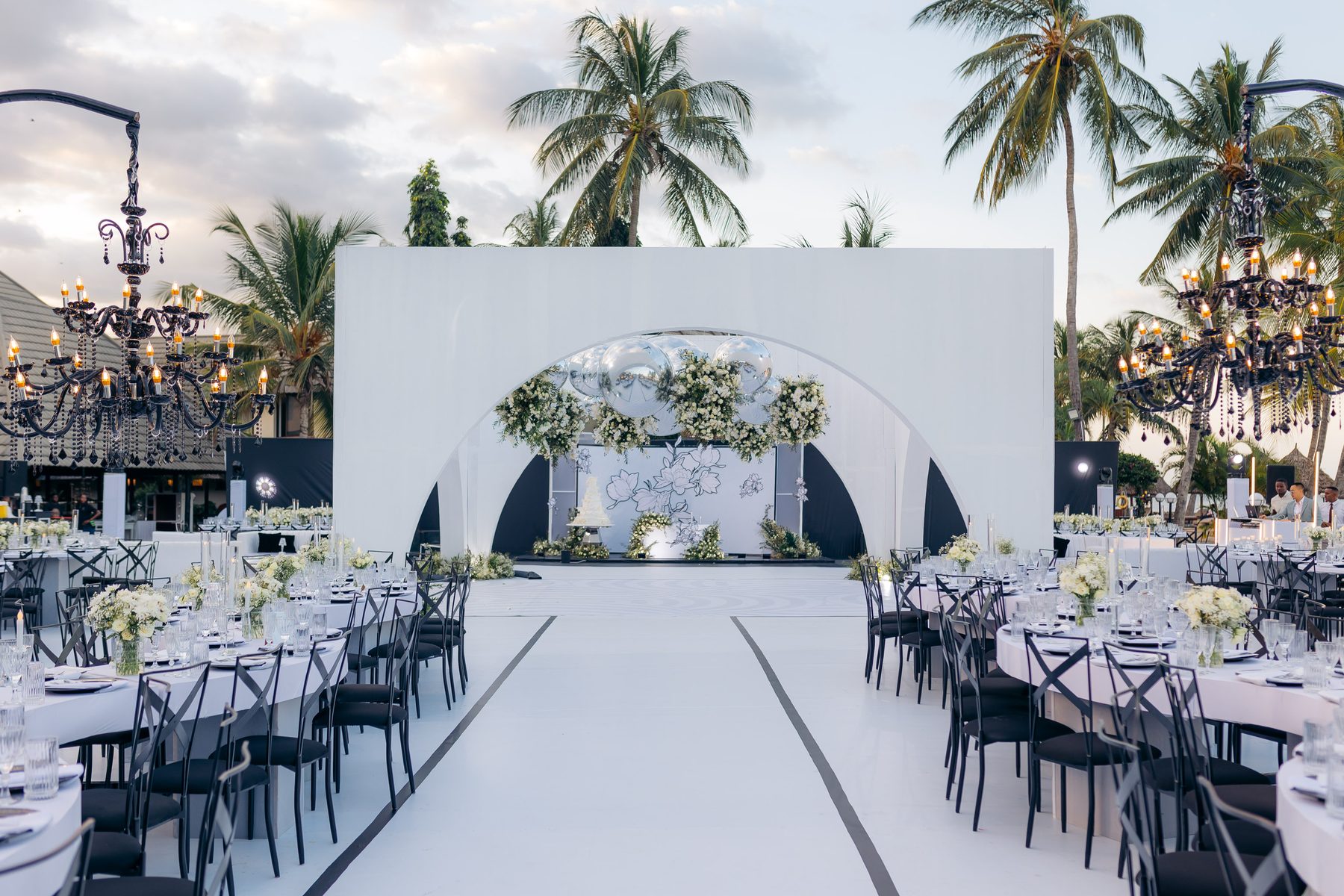 Anthony & Irene wedding at White Sands Resort, Dar es Salaam, by Kevins Events — the reception reveal beneath the arch