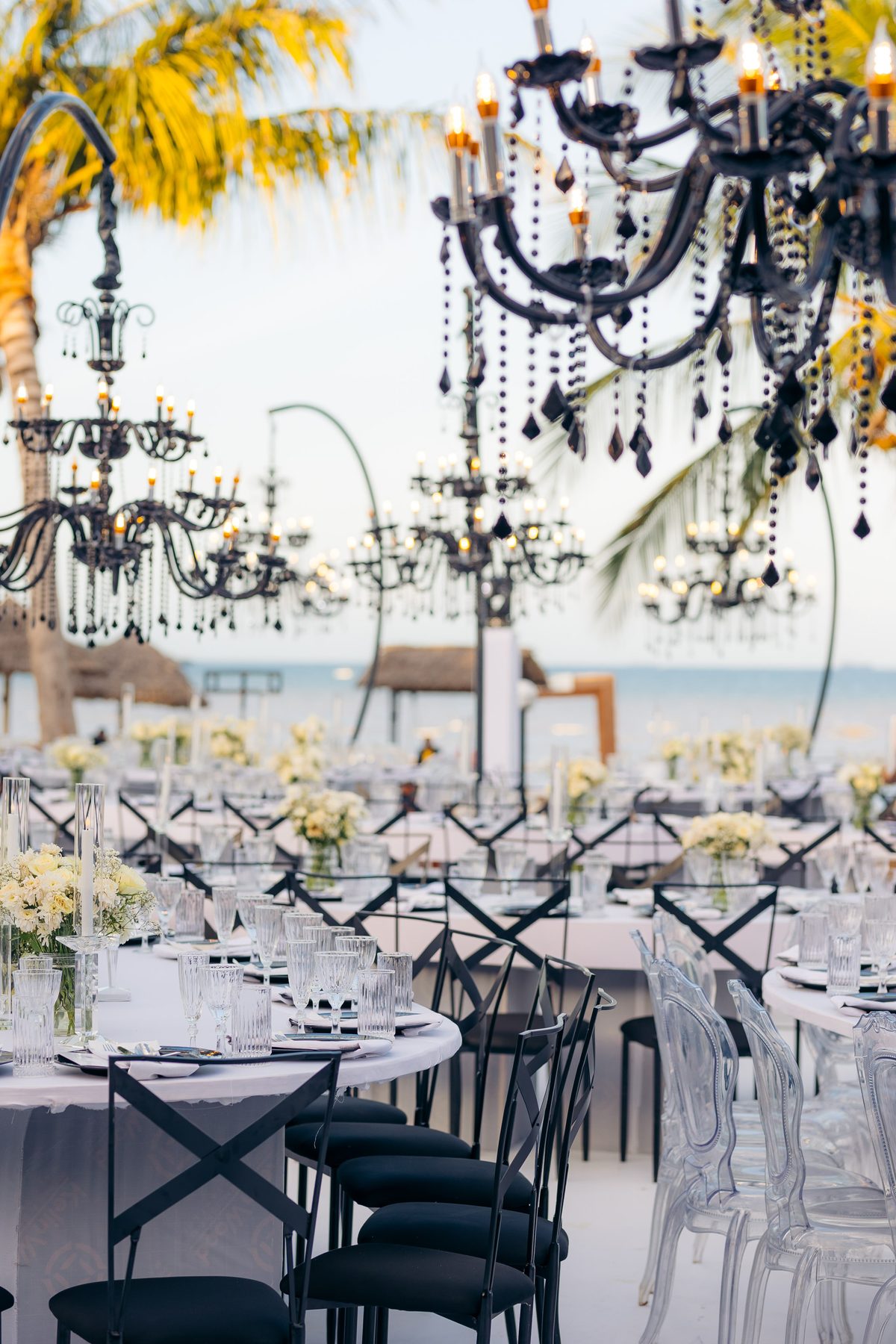 Anthony & Irene wedding at White Sands Resort, Dar es Salaam, by Kevins Events — suspended black chandeliers over the tables