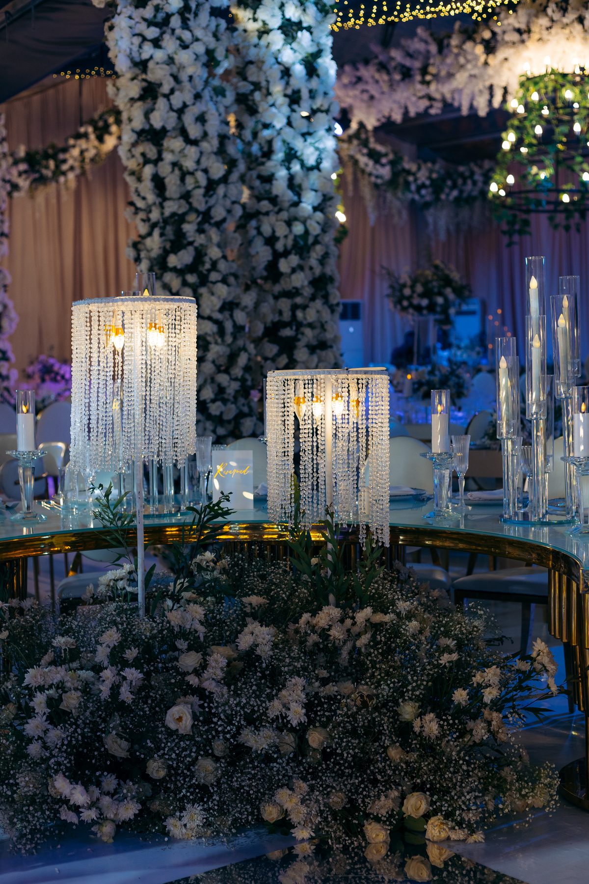 Jordan & Doria wedding at Serena Hotel, Dar es Salaam, by Kevins Events — crystal lamp and floral tablescape detail