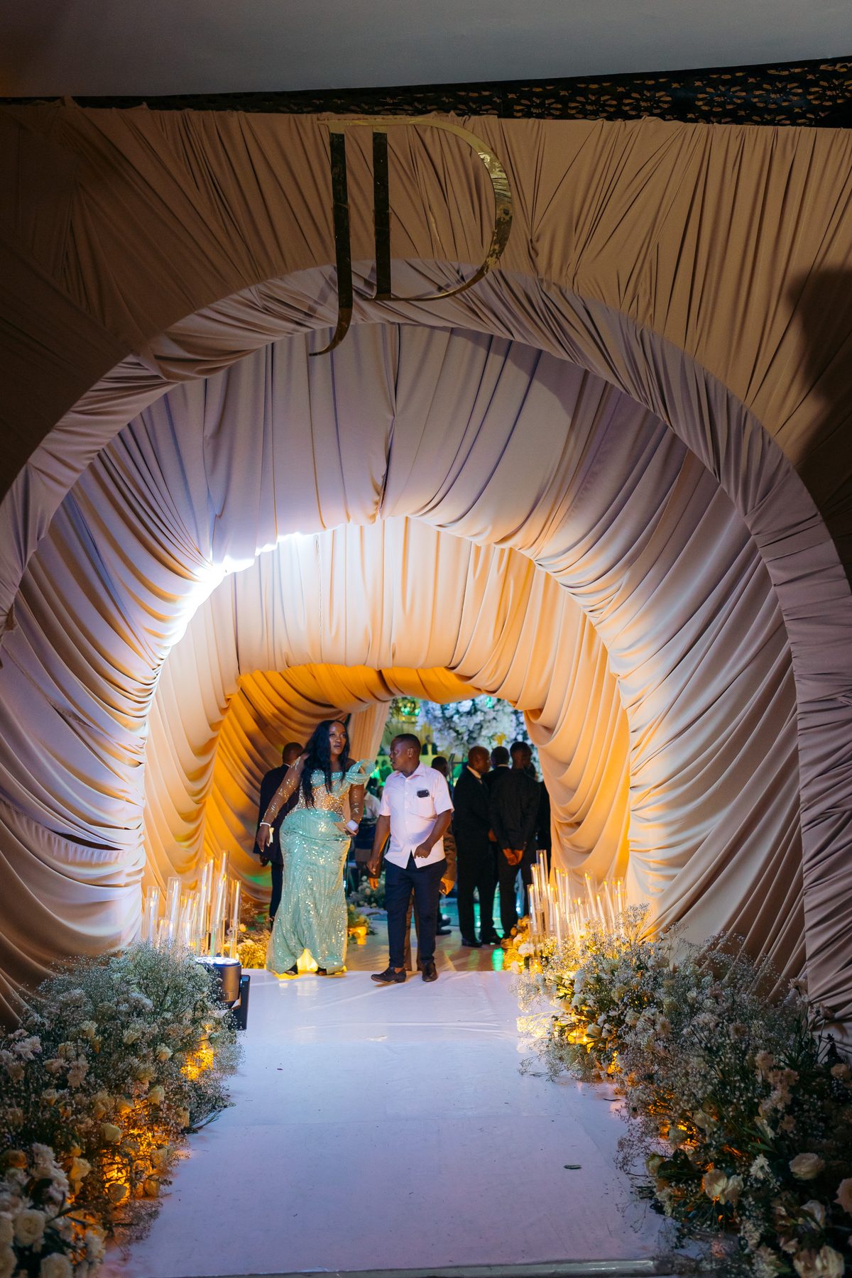 Jordan & Doria wedding at Serena Hotel, Dar es Salaam, by Kevins Events — the draped arrival archway