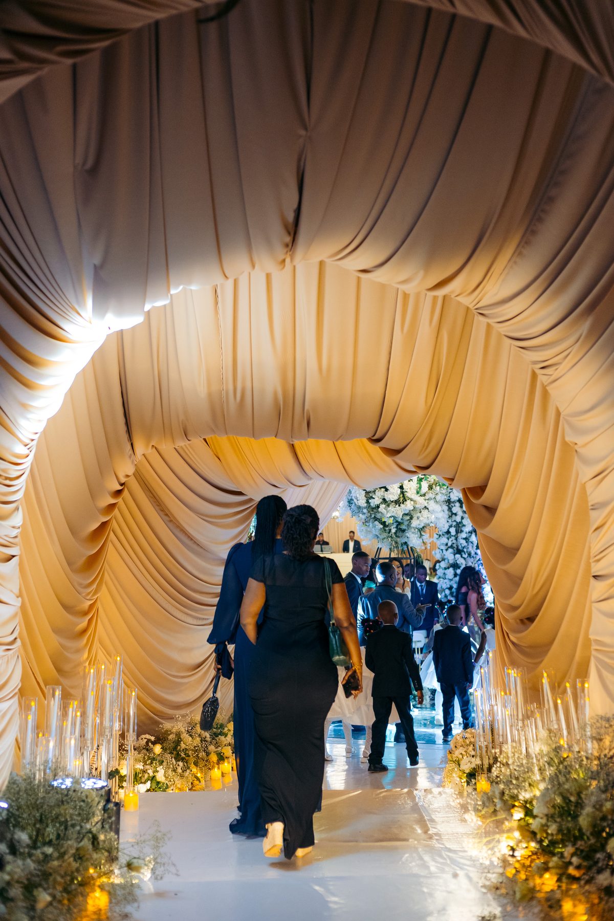 Jordan & Doria wedding at Serena Hotel, Dar es Salaam, by Kevins Events — guests arriving through the draped tunnel