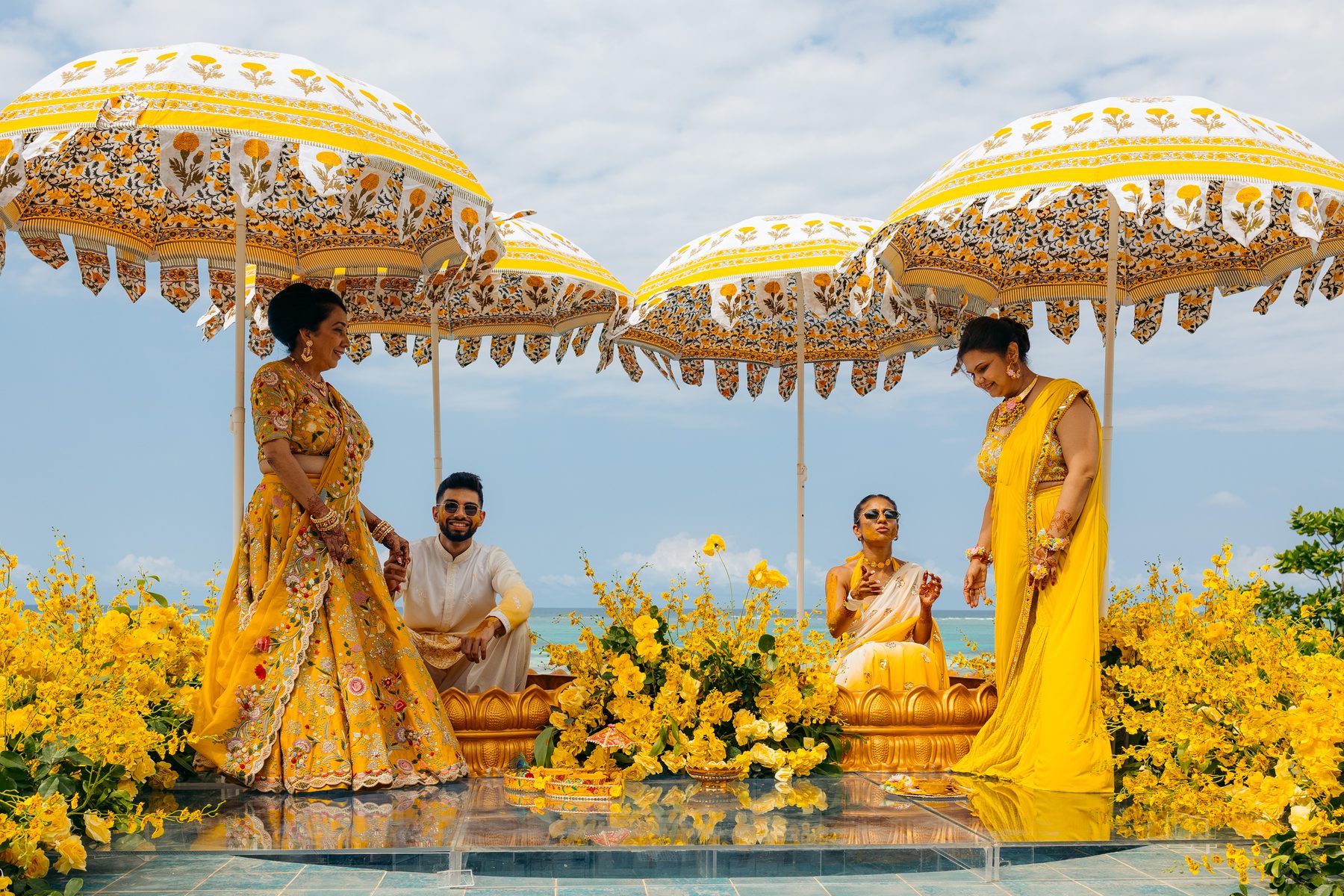 Sonia & Miraj wedding in Zanzibar — haldi family umbrellas — by Kevins Events