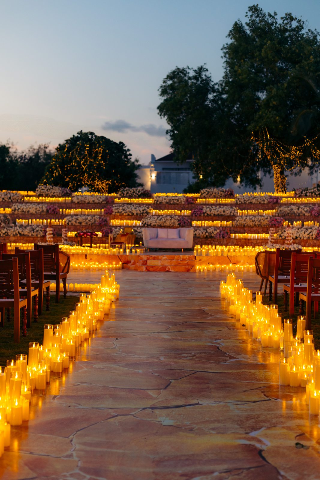 Sonia & Miraj wedding in Zanzibar — the candlelit aisle at dusk — by Kevins Events
