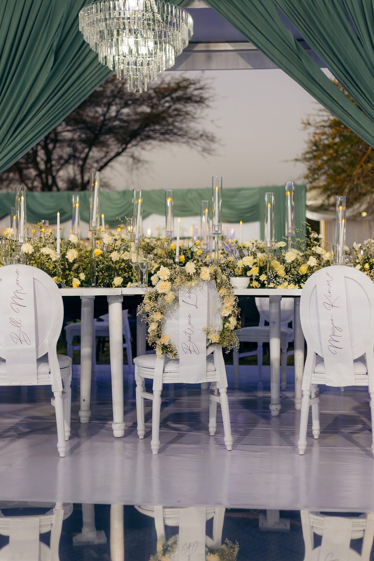 With Love, Bea — Beatrice's celebration at Kili Seasons, Arusha, by Kevins Events — candlelit tablescape with named chairs