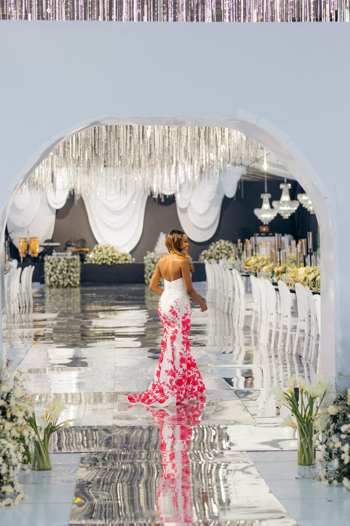 With Love, Bea — Beatrice glancing back beneath the crystal archway at Kili Seasons, Arusha, by Kevins Events